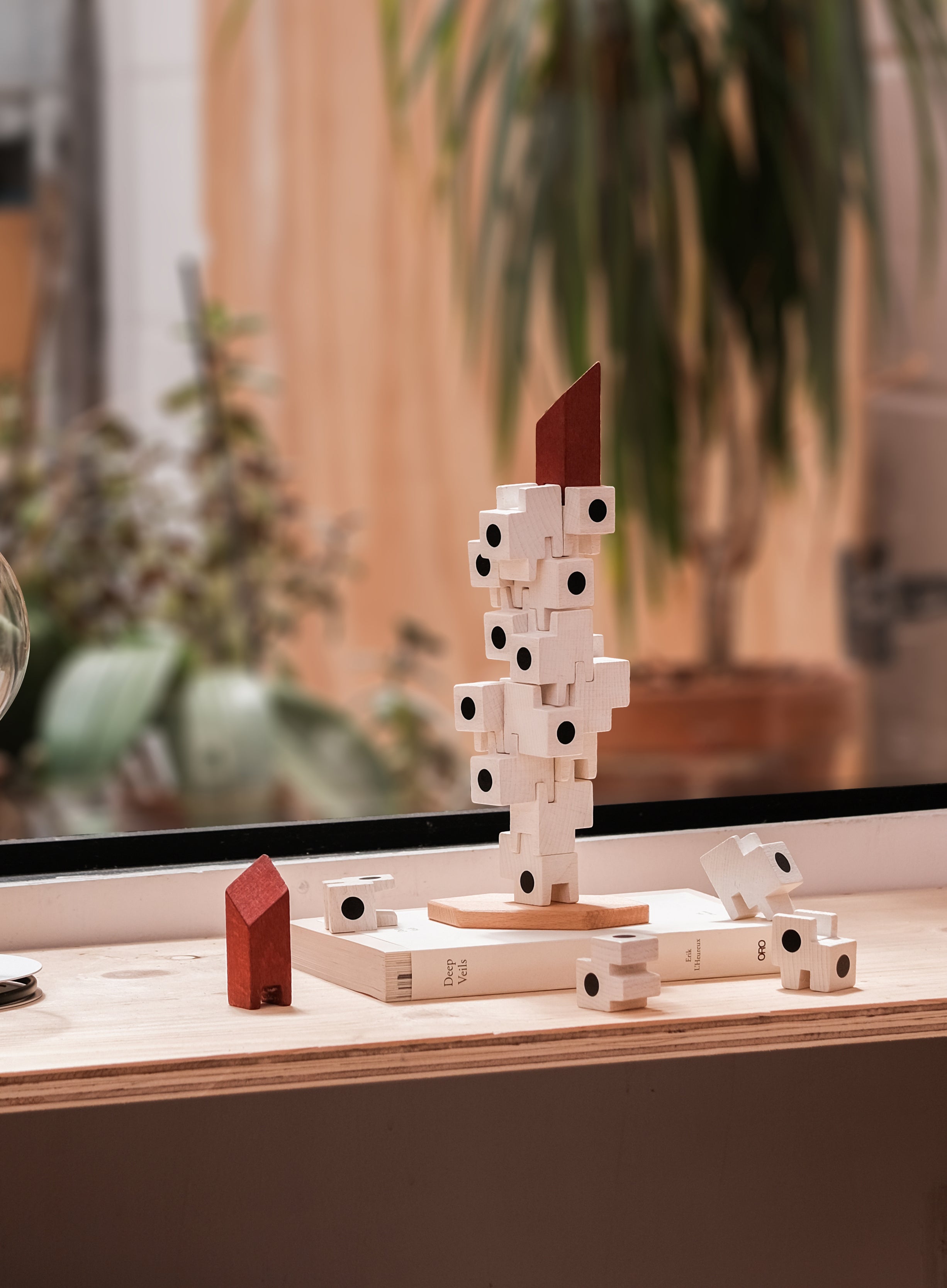 The Capsule Tower building blocks game, half assembled on a shelve.